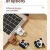 A variety of cartoon bear and panda desk cable organizers in various colors and designs are shown on a wooden surface.