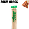 A set of natural bamboo skewers, ranging from 30cm to 90pcs, is shown alongside prepared meat skewers.