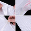 Close-up view of self-sealing pearl film bubble shipping bags showing the clear plastic and sealing mechanism.