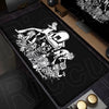 A black mouse pad featuring a white, detailed illustration of a skull and various figures related to the Death Note theme.