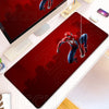 A red Spider-Man anime themed desk mat featuring a character in a dynamic pose, placed on a white surface.