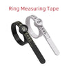 A black ring measuring tape is shown next to a white ring, demonstrating how to measure rings.