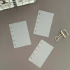 A set of ten transparent divider pages for M5 and A8 loose-leaf planners is shown with a gold-colored clip.