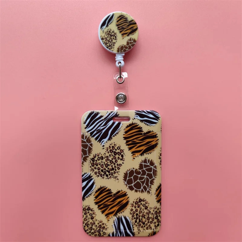 A leopard print card holder clip featuring a textured background with brown and black animal prints.