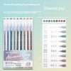 A set of Advanced Grey painting and journaling pens featuring various shades of gray and blue ink.