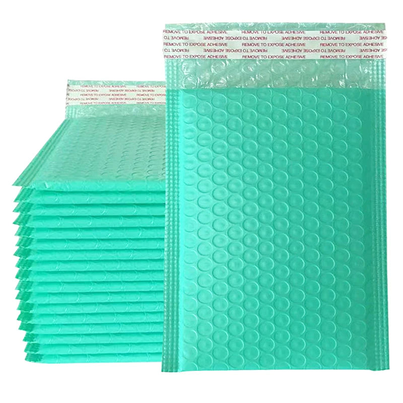 A stack of teal padded bubble mailers with self-seal closures.
