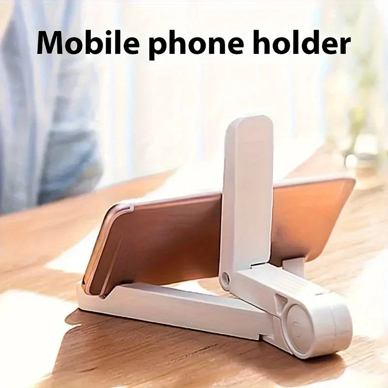 Weißes Handyhalter, um ein Tablet oder Smartphone auf einer Holzoberfläche zu stützen.