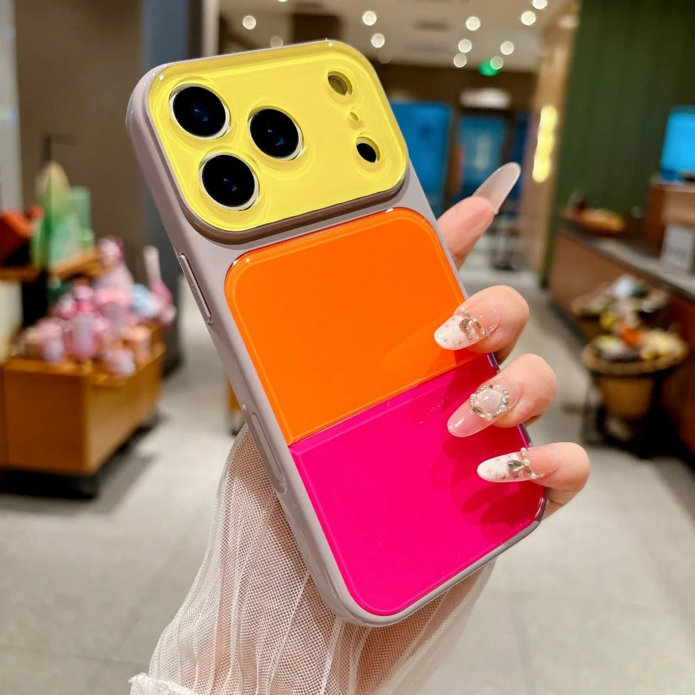 A hand holds a Dopamine Multicolor Block Acrylic phone case for iPhone featuring yellow, orange, and pink layers.