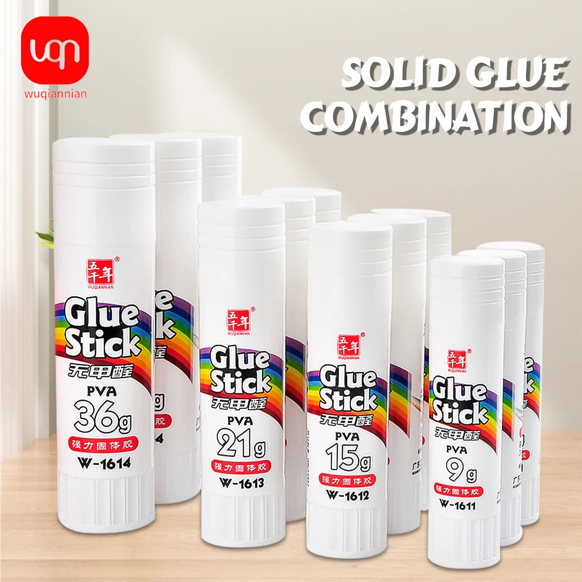 A collection of white Glue Stick products with various PVA glue sizes and packaging shown on a wooden surface.