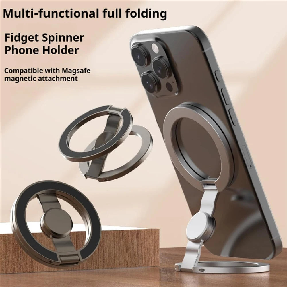 A silver magnetic phone holder with a fidget spinner attachment shown next to a smartphone.