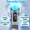A silver portable semiconductor cooling fan emitting a bright blue beam in a snowy environment.