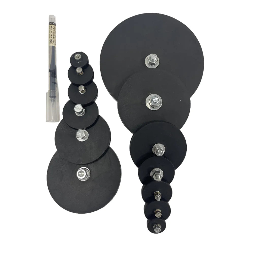A stack of black magnetic base mount brackets for LED lights with a single metal rod visible.