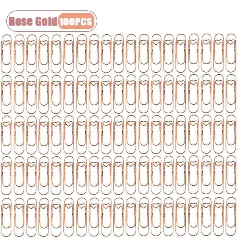 A sheet of rose gold metal pen clips for notebooks and journals.