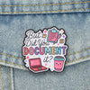 An enamel pin featuring the text But Did You Document It? with a laptop and a cup illustration.