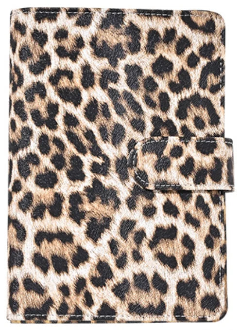 A leopard print A6 binder with a black elastic closure and 6-hole loose leaf system.