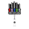 A set of colorful acrylic nurse ID badge holders with varying sizes displayed against a black textured background.