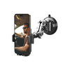 A smartphone is mounted on an articulating suction cup car phone mount with a clamp and arm.