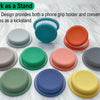 A set of round silicone grips designed as a phone grip holder and kickstand in various colors.