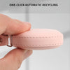 A hand holds a pink PU leather measuring tape, demonstrating one-click automatic recycling.
