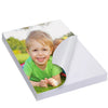 A photo of a smiling toddler outdoors is shown on a sheet of glossy self-adhesive photo paper.