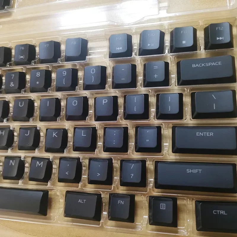 A close-up view of replacement keycaps for a Dell Alienware AW510K keyboard showing various function keys and modifiers.