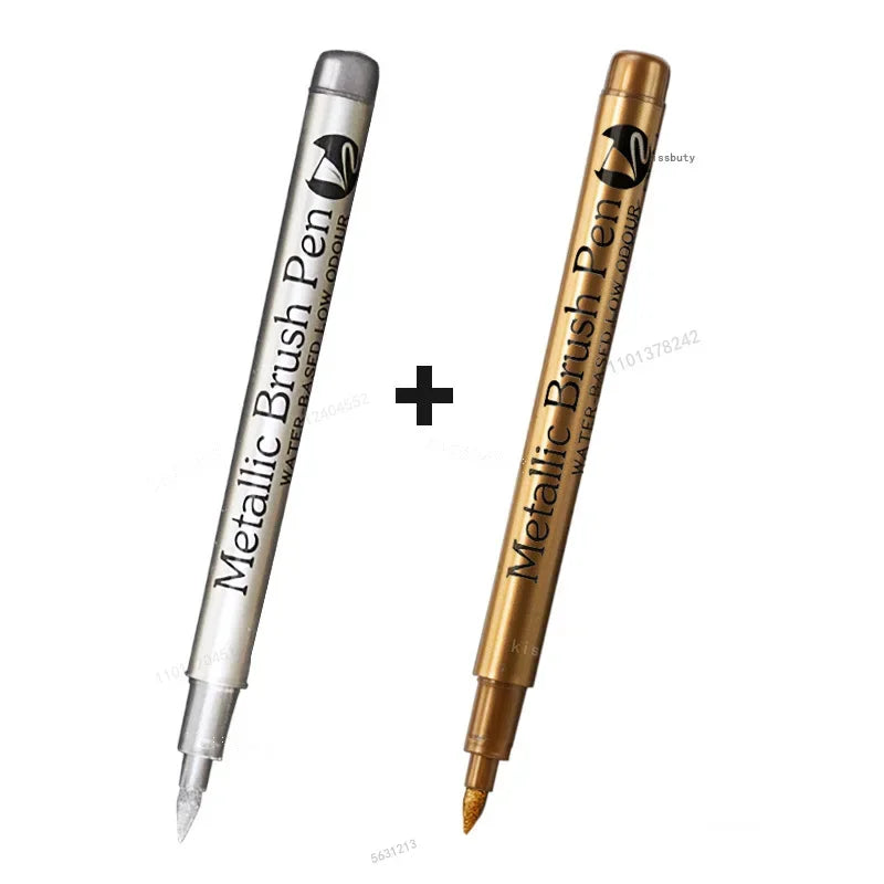 A set of metallic brush pen markers shown side by side, featuring silver and gold finishes.