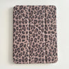 A protective leather case for an iPad featuring a brown and black leopard print pattern.