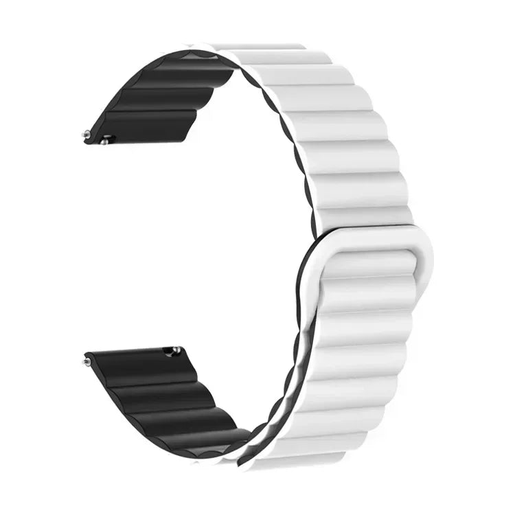 A close-up view of a white and black adjustable magnetic loop watch band.
