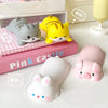 A set of pink and gray kawaii ergonomic wrist rests shaped like cats and a pig for mouse and keyboard use.