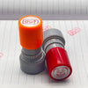 A set of self-inking rubber stamps featuring an orange and red funny meme face design.