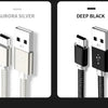 Two braided mini USB to USB charging cables, one silver and one black.