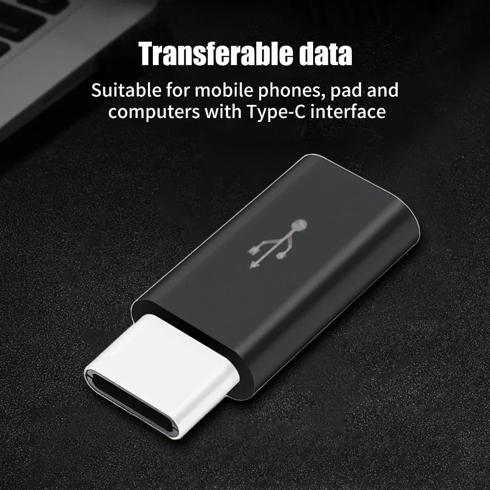 A black USB Type-C to Micro USB adapter converter is shown on a dark surface.
