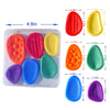 A clear box containing various colored silicone sensory fidget stones and fidget toys for stress relief