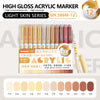 A set of 12 high-gloss acrylic marker pens in the Light Skin series, featuring various shades of pink and nude colors.