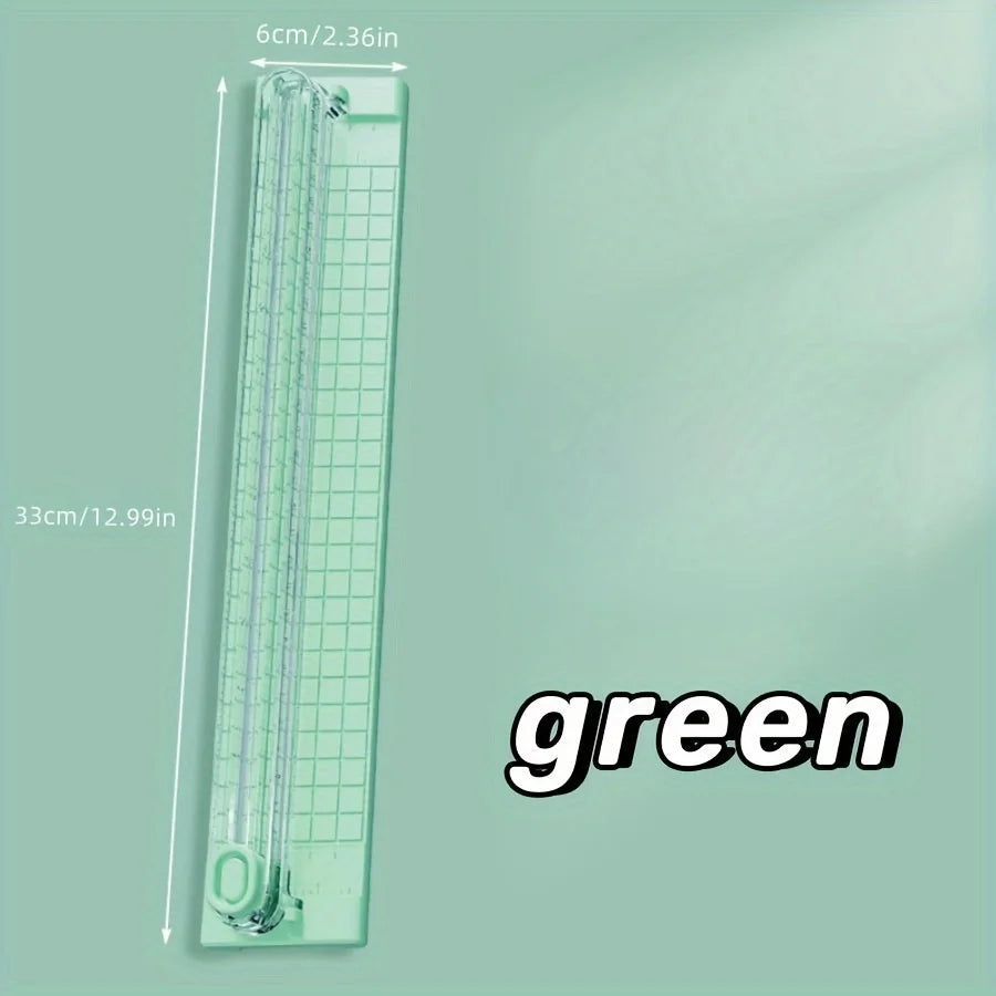 A green portable manual paper cutter trimmer with a 33cm length and 6cm width.