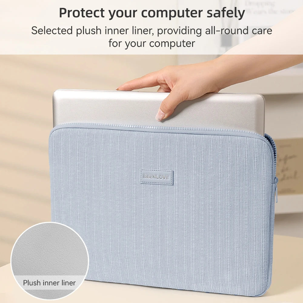 A light blue padded laptop sleeve with a zipper and a sewn-in label is shown being held by a hand.