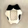 A plush photocard holder featuring a black and white design with a clear window.