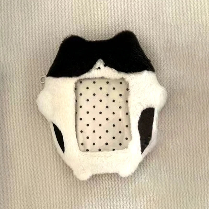 A plush photocard holder featuring a black and white design with a clear window.