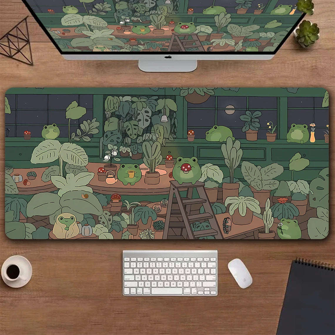 A large desk mat featuring a detailed illustration of various green frogs and lush potted plants.
