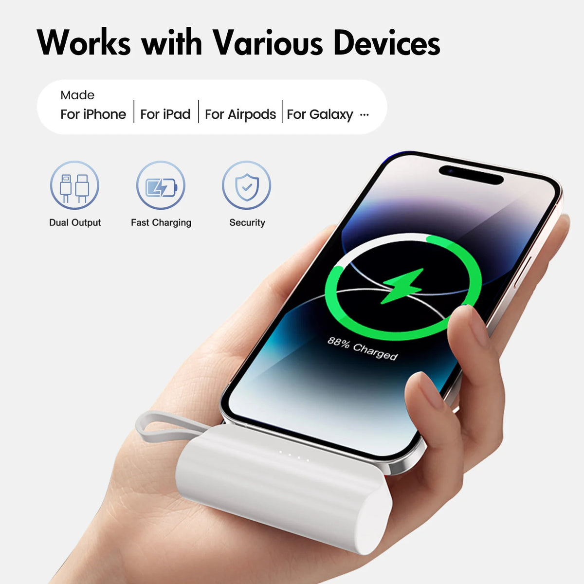 A hand holds a white compact power bank with a USB-C cable connected to an iPhone, demonstrating its charging capability.
