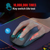 A hand is using a black gaming mouse with blue accents and RGB lighting on a dark surface.