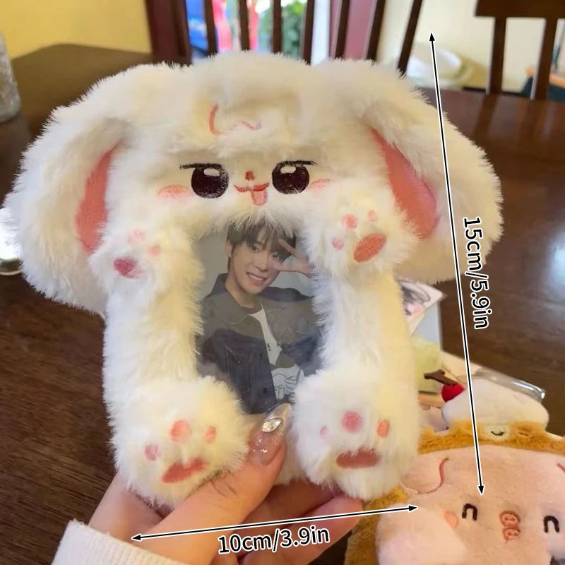 A white plush animal shaped like a rabbit, designed to hold and display K-pop photocards.