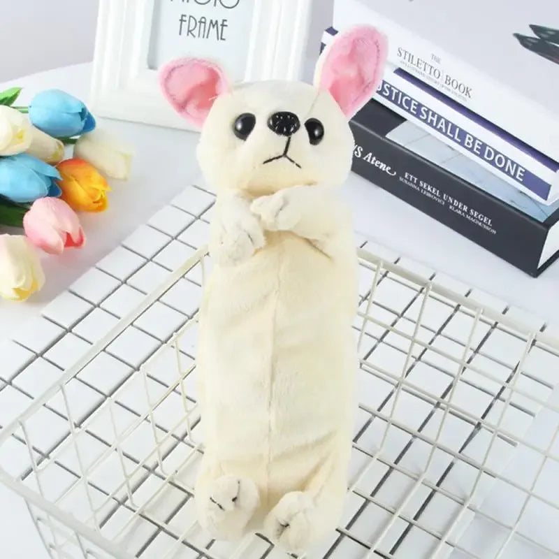 A fluffy white plush dog toy with pink ears is displayed on a wire grid next to a book.