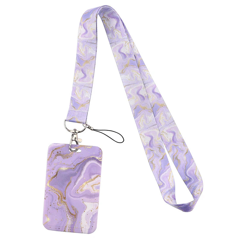 A purple marbled lanyard with a gold-colored clip and strap for ID badges and accessories.