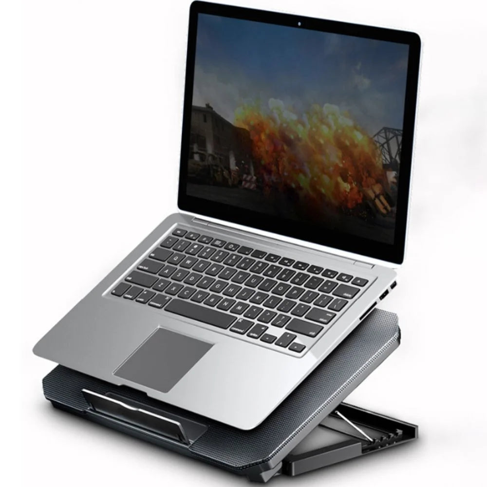 Silver laptop resting on an adjustable metal cooling pad with an integrated LED fan.