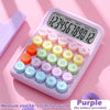 A purple 12-digit desktop calculator with mechanical keys and various colored buttons is shown on a pink background.
