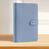 A light blue reusable binder with a grey cover and silver metal binding.