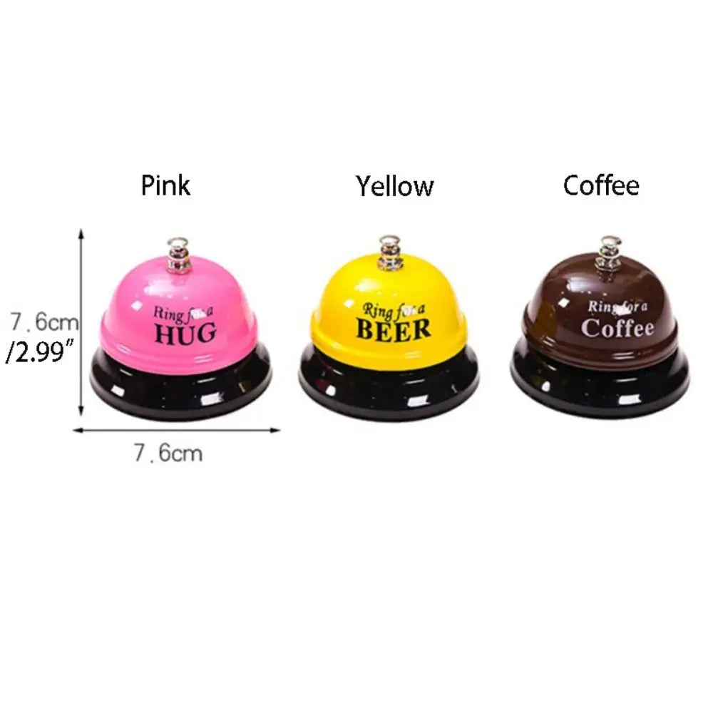Three metal service bells in pink, yellow, and coffee colors for desk or counter use
