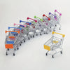 A row of colorful mini shopping carts with rolling wheels and side pockets arranged horizontally.