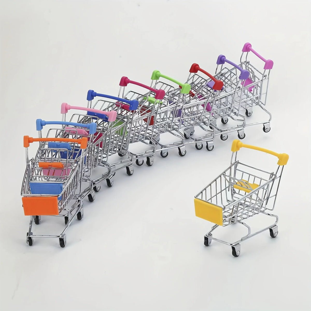 A row of colorful mini shopping carts with rolling wheels and side pockets arranged horizontally.
